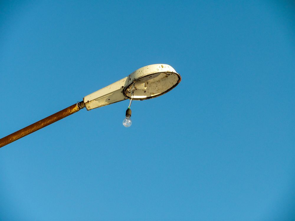 Street lamp against the blue sky