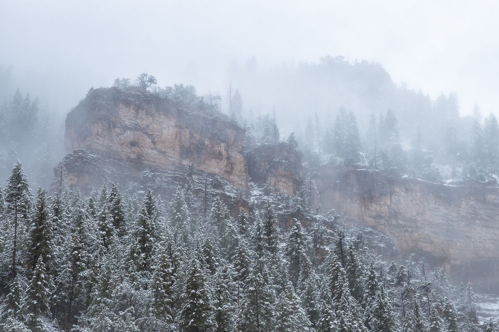 Snowy canyon under the fog
