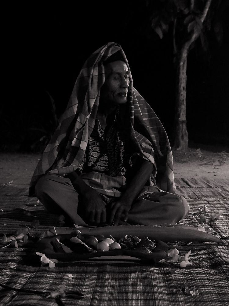 A man is following a traditional healing ritual