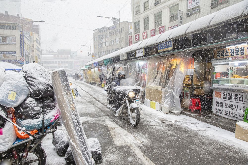 Motorcycle delivery man's winter.
