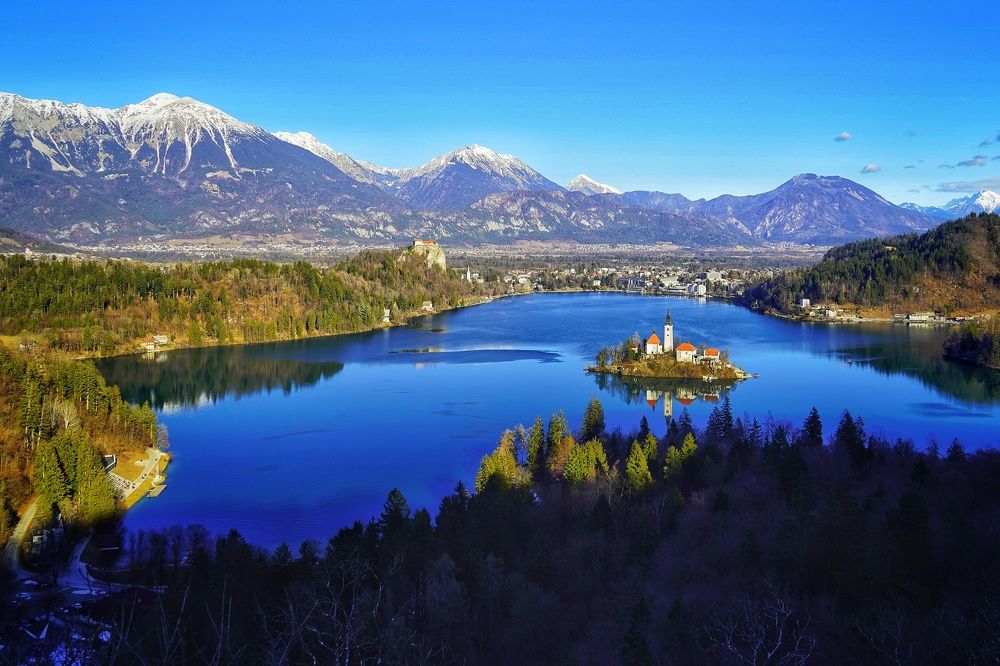 aerila photo of lake Bled with island and castle
