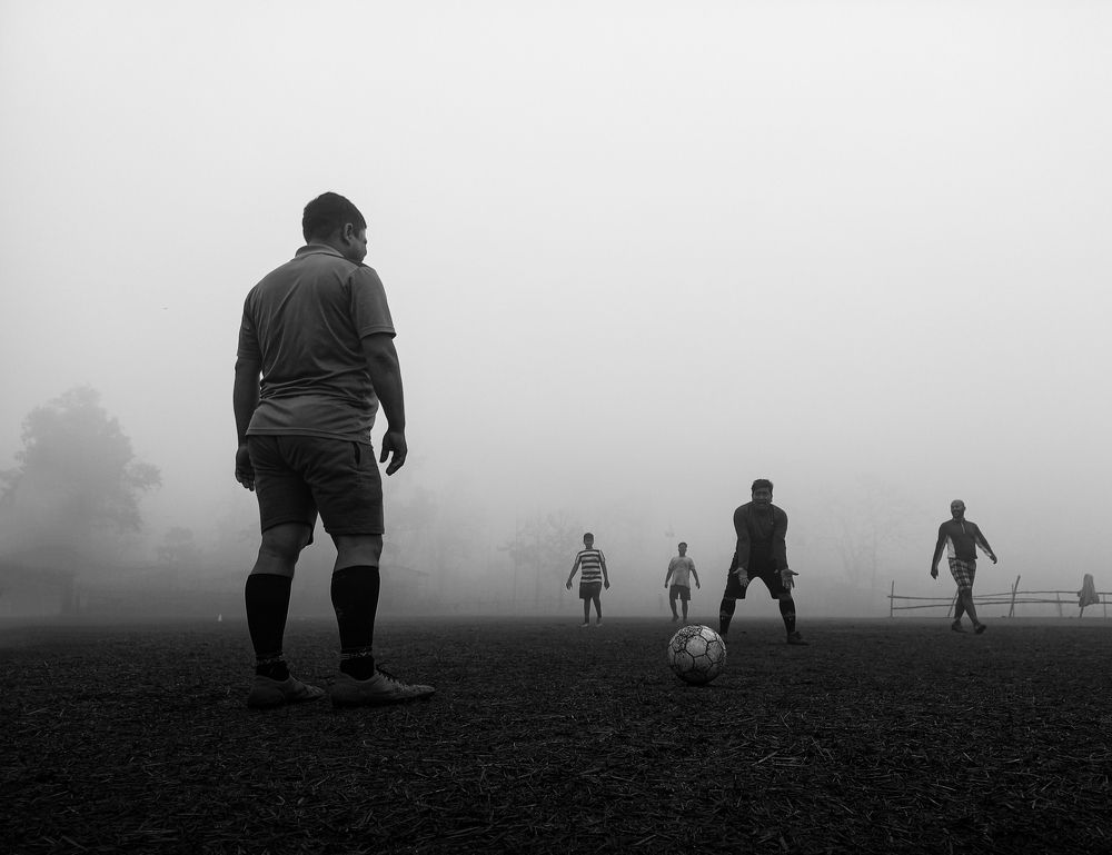 Playing Football On A Winter Morning.