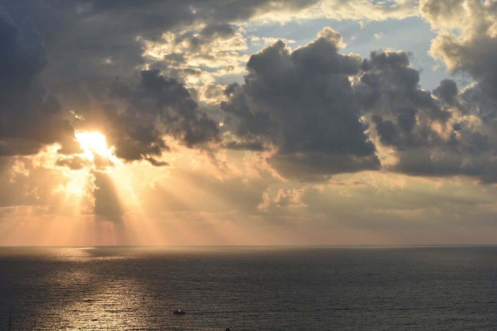 Sunlight breaking through storm clouds