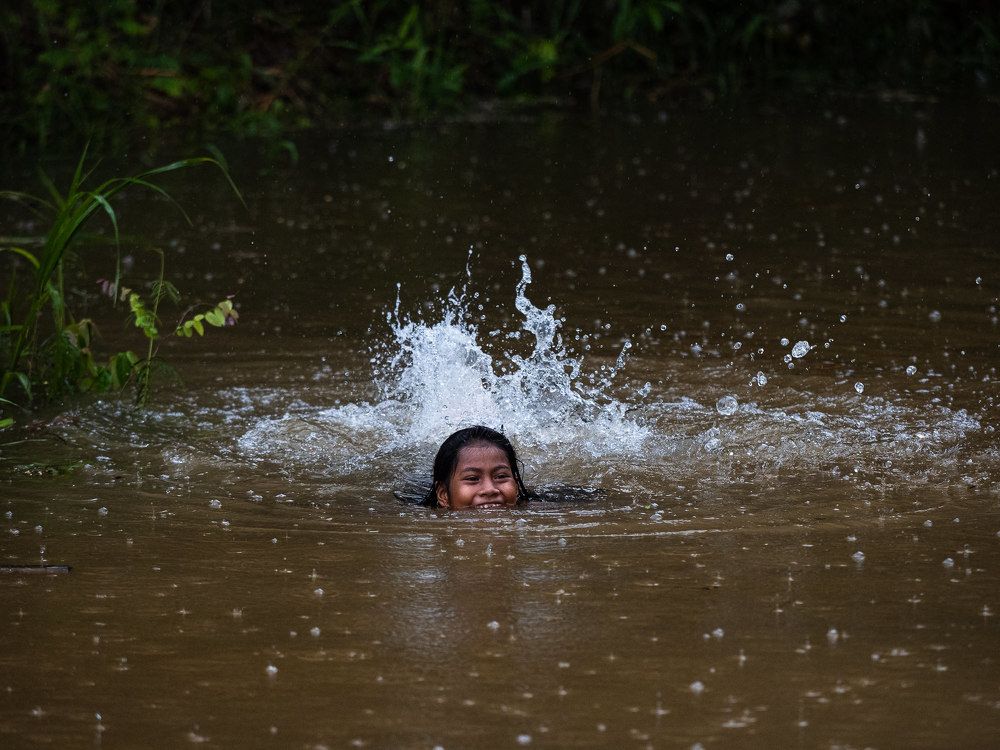 Children in the Amazon River
