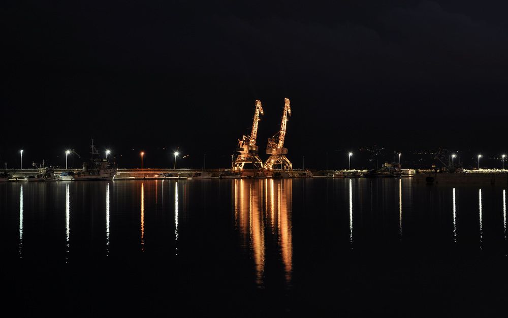 Rijeka harbour with illuminated cranes