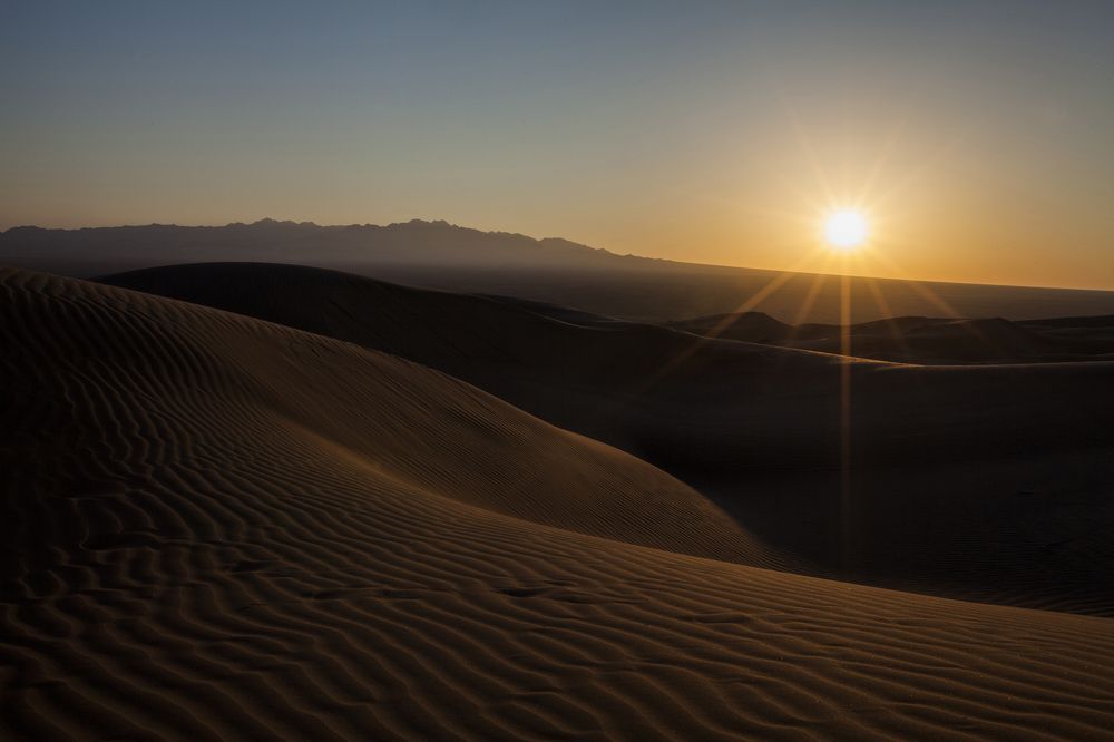 Sun shining over desert