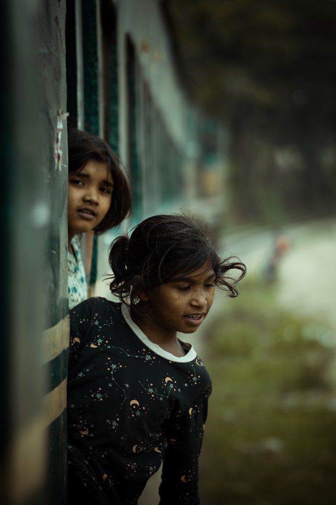 Children are enjoying the shuttle train journey.
