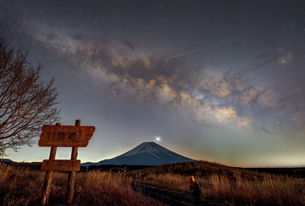 Walking alone under the night sky