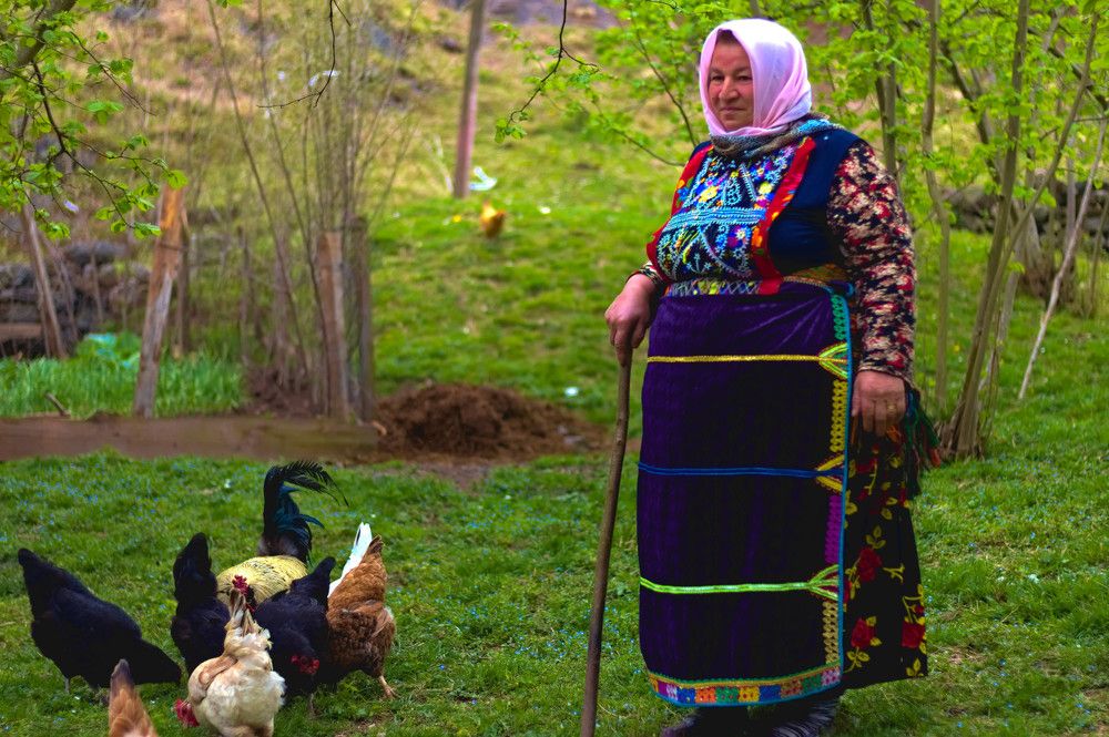 A happy woman with her chickens
