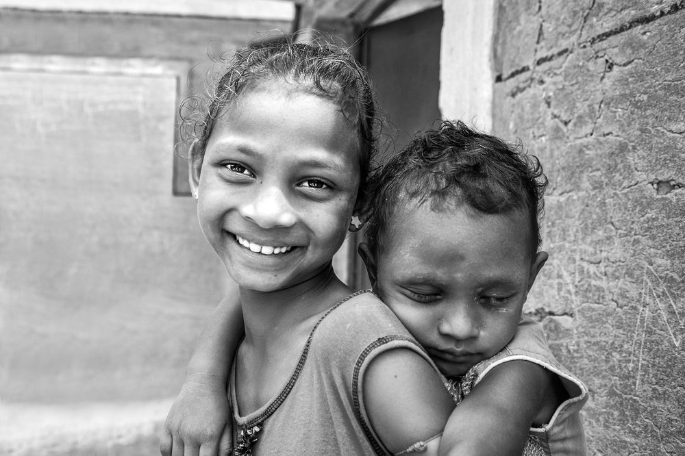 The little mother assuring  her brother with a comfort sleep