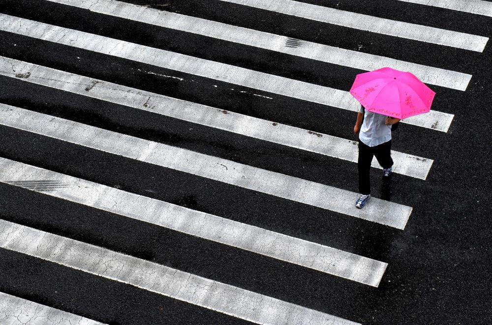 The man with pink umbrella