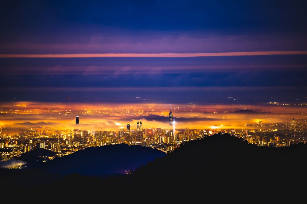 City of Kuala Lumpur under layered clouds