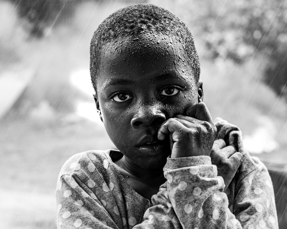 Portrait of Nkem under the rain.