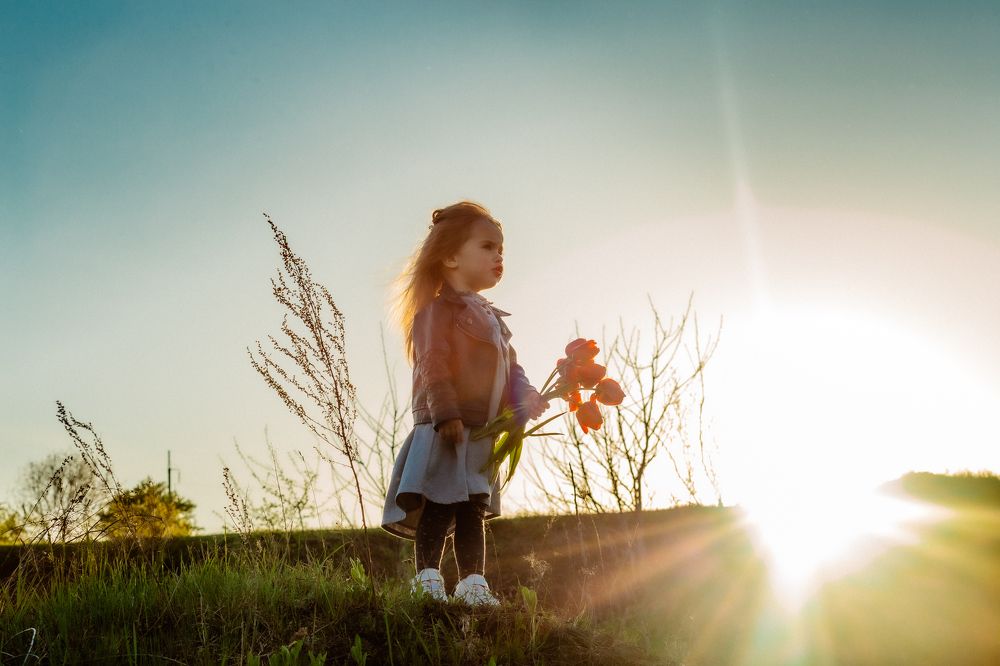 Little girl of tulips