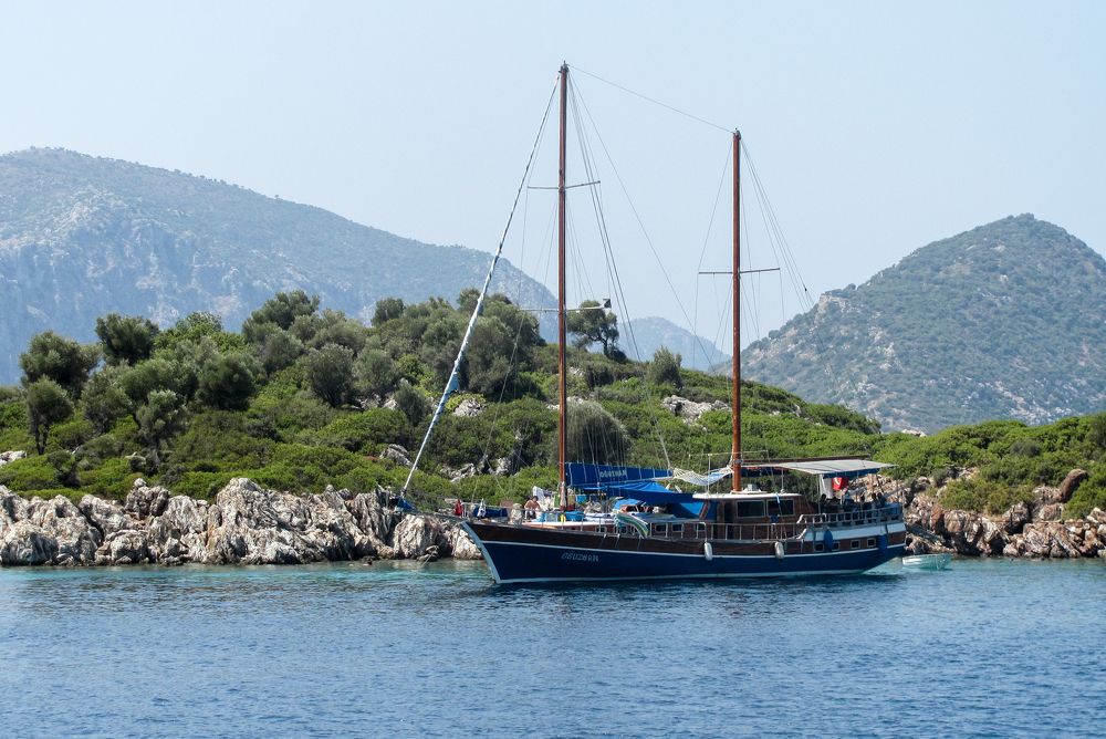 Ship off the coast of rocky islands