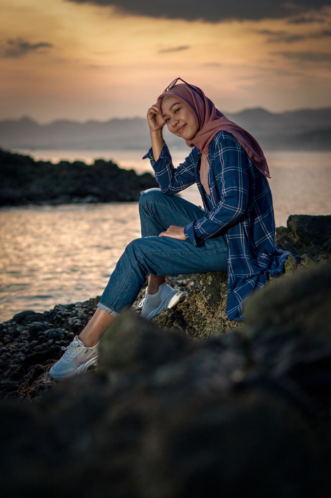 LADY WEARING HIJAB ON THE BEACH