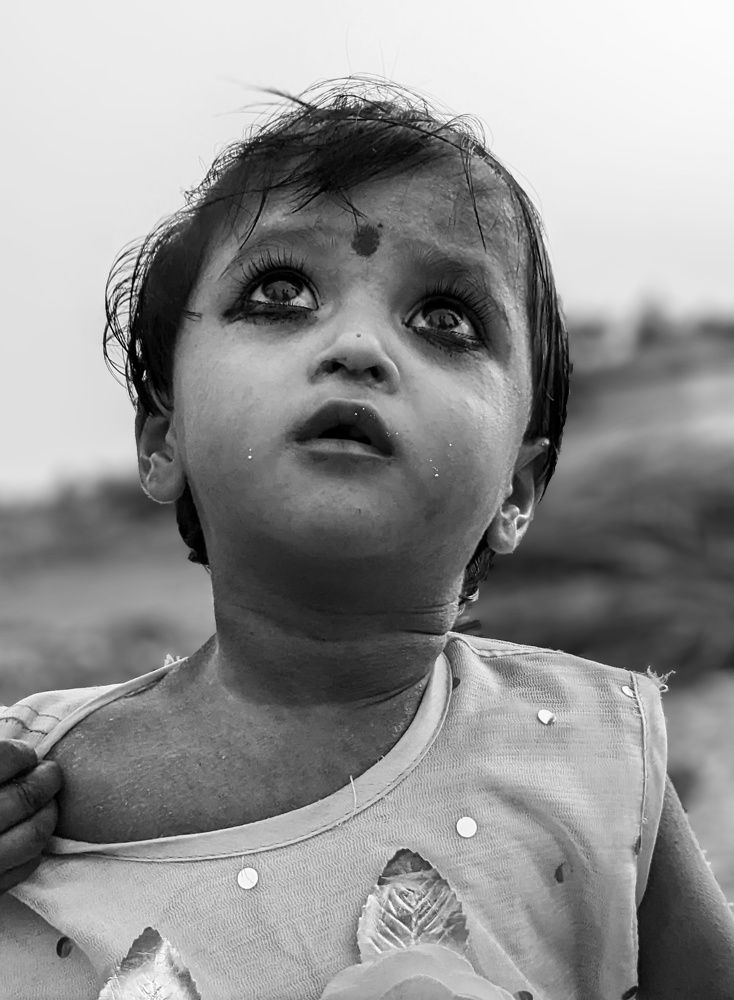A Child Looking Over The Sky
