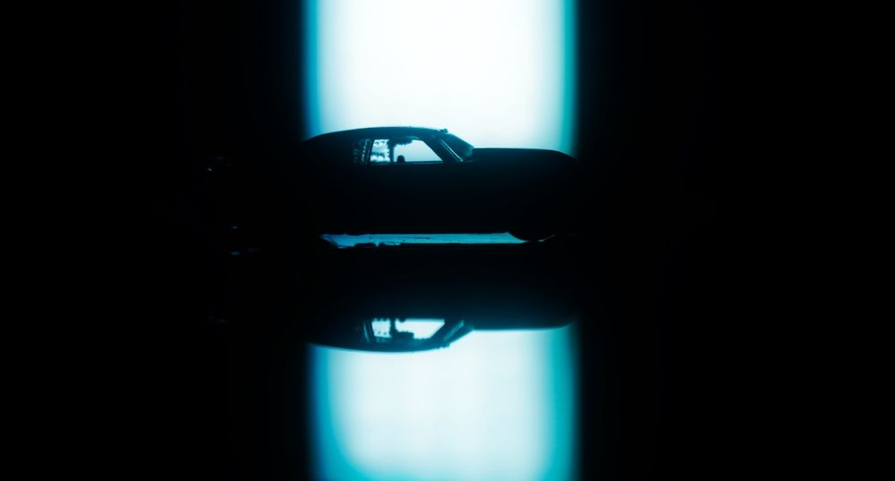 The structure of a car is visible through the light