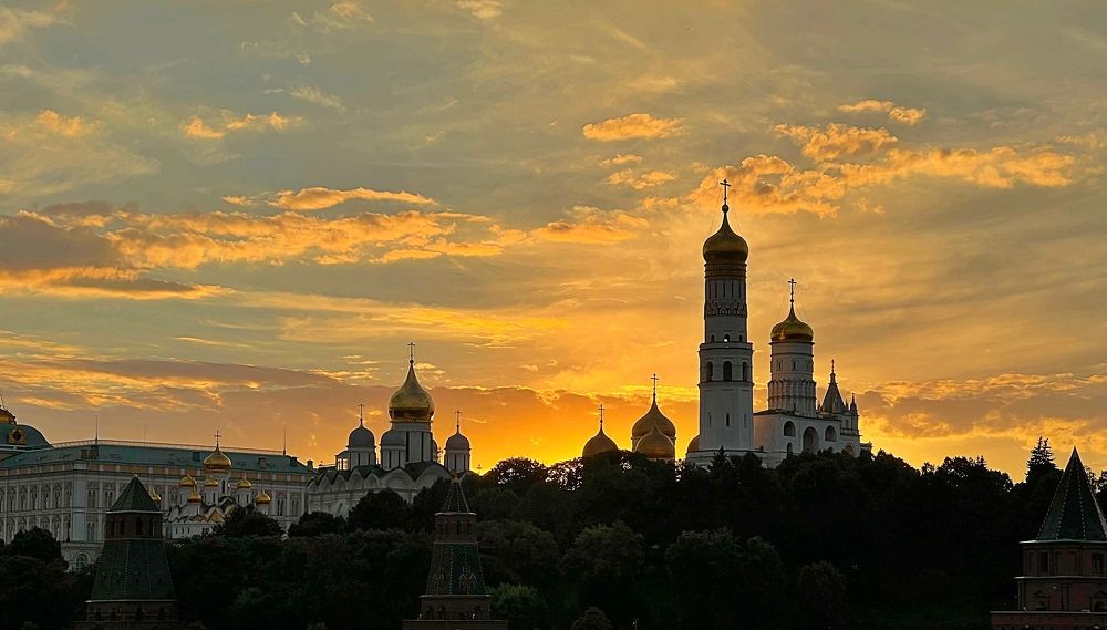 Sunset over the domes of the Kremlin Churches. Moscow, Russia.