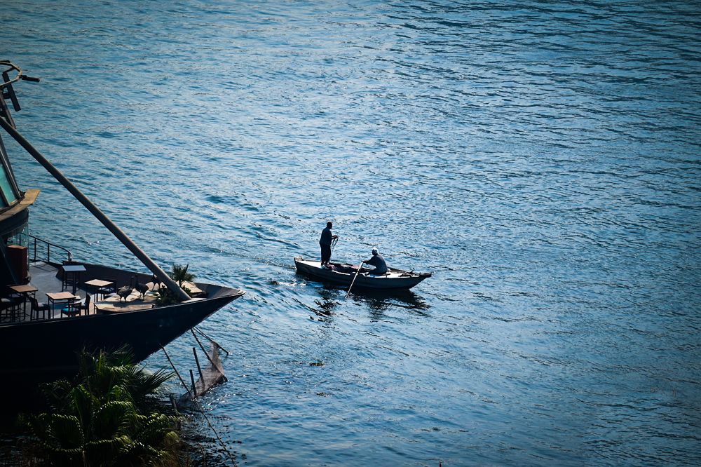 Fishermen sailing in the river