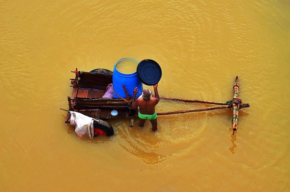 Remote Villagers collecting water from River