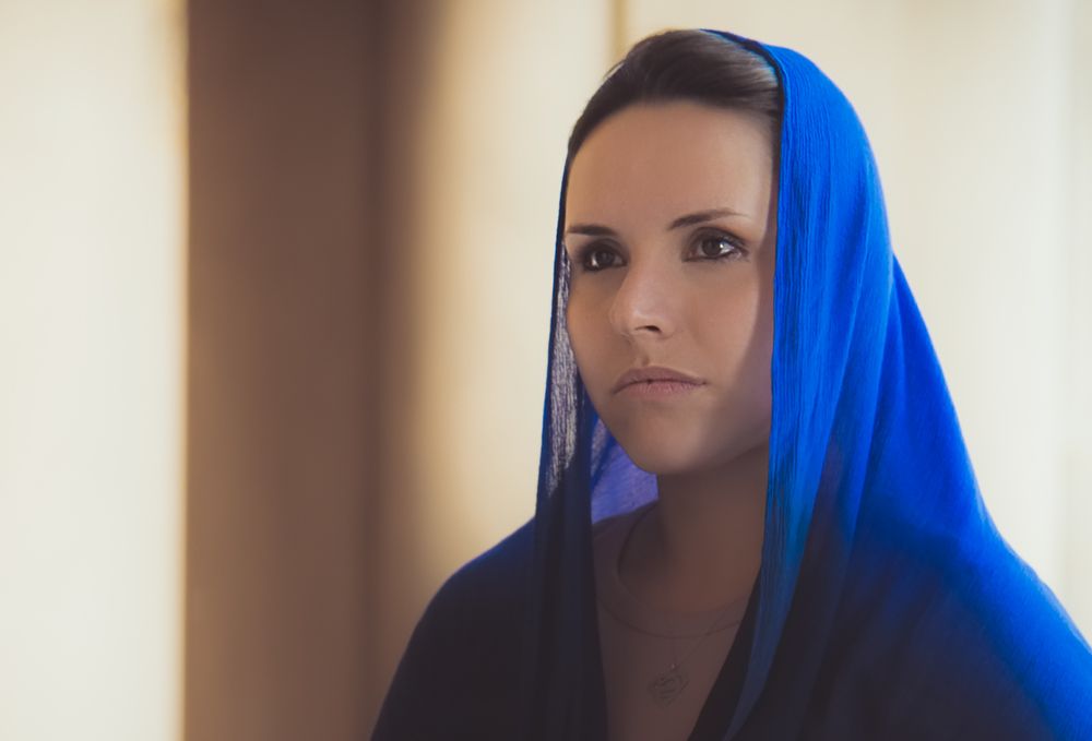 Praying in royal blue