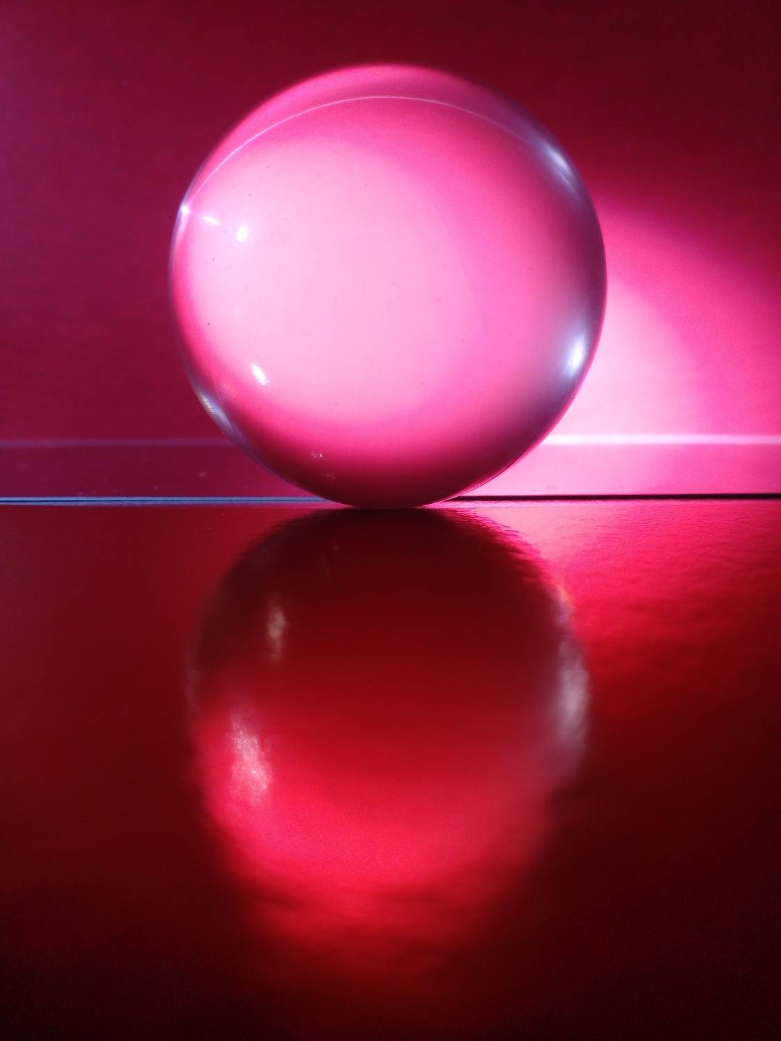 Red sphere in reflection.
