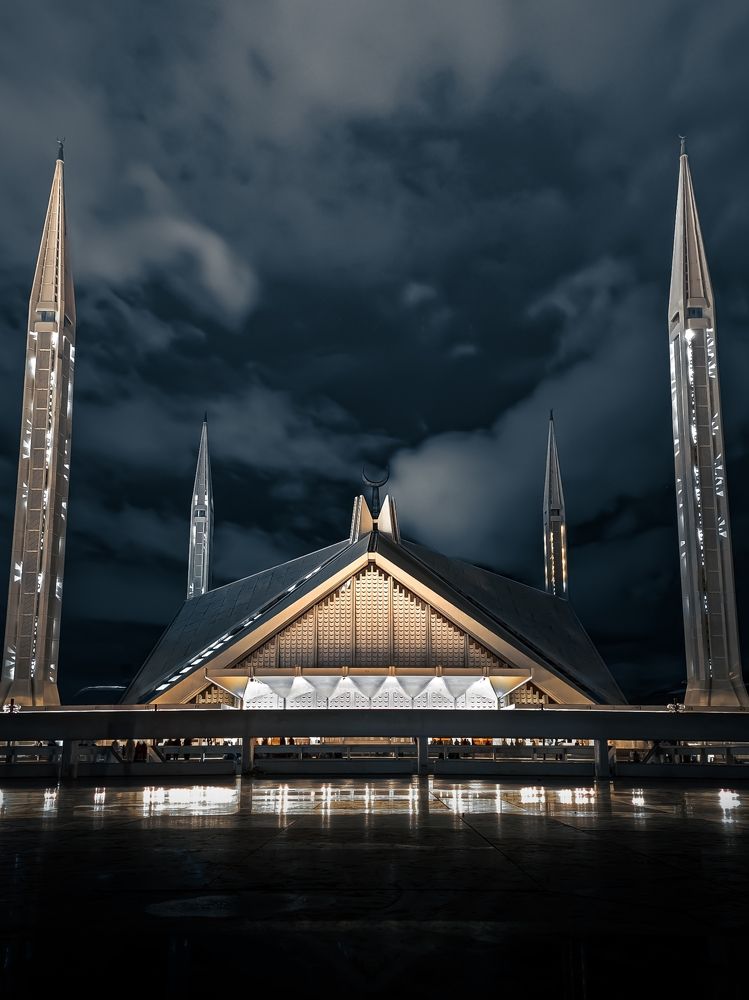 The beautiful Shah Faisal Mosque illuminating under the night sky- Islamabad, Pakistan