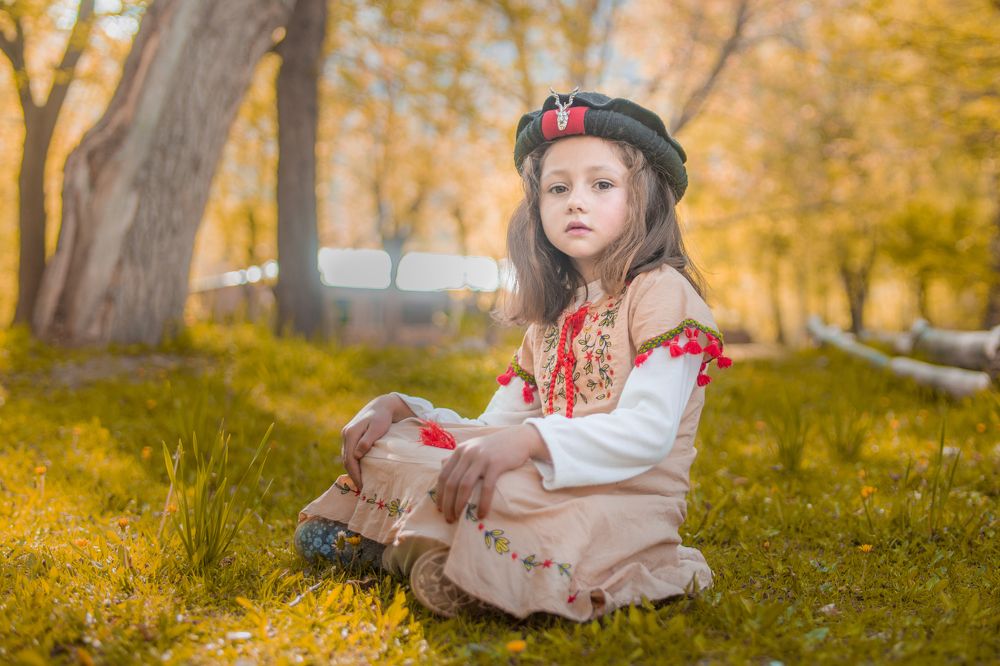 Lovely little cute girl wears Chitrali traditional cultural cap PAKOL