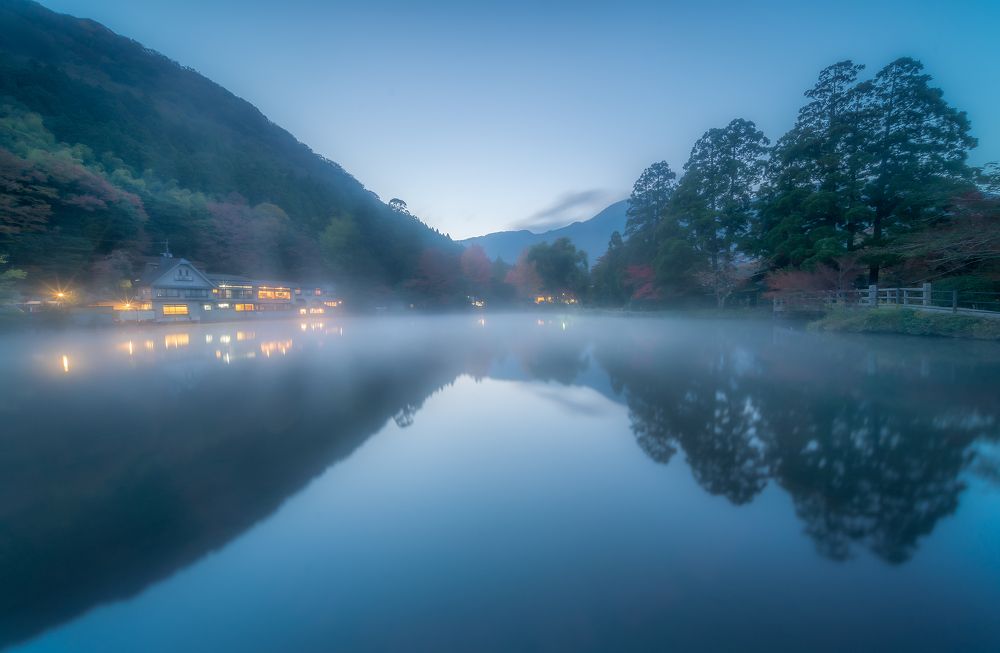 Dawn on the foggy lake