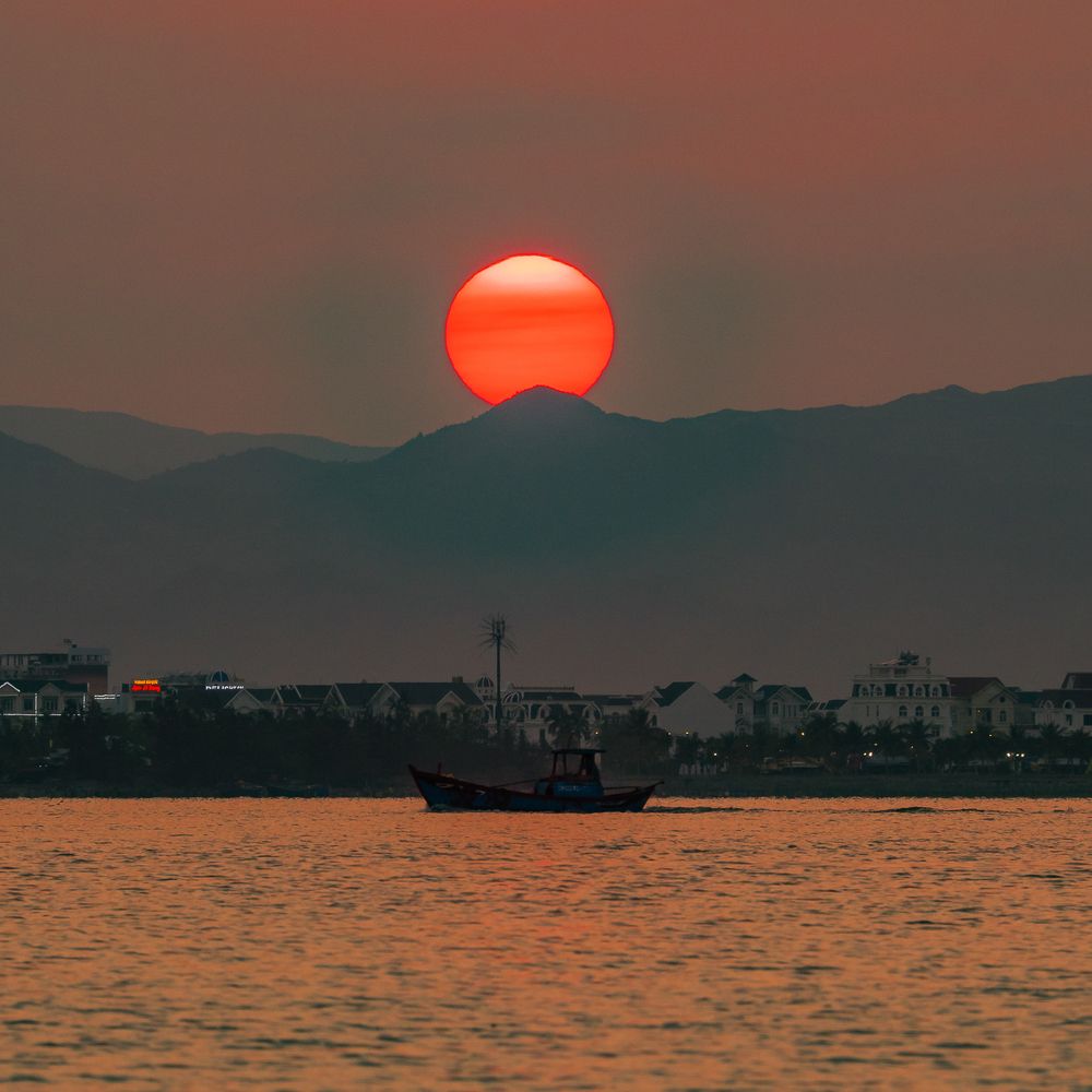 the sun setting on the horizon