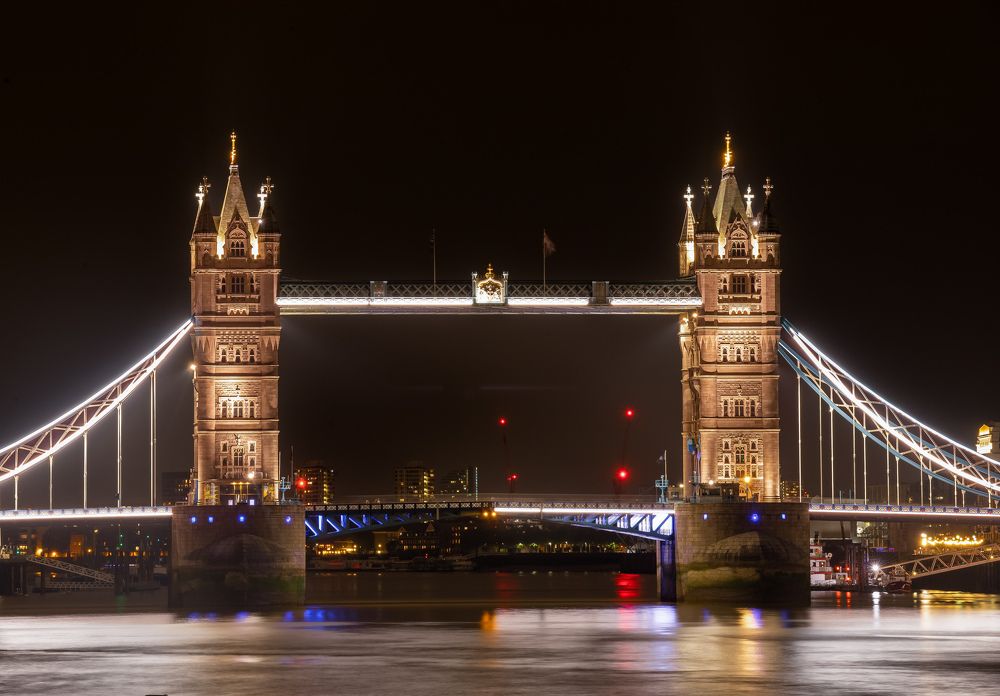The famous Tower bridge of London at night.