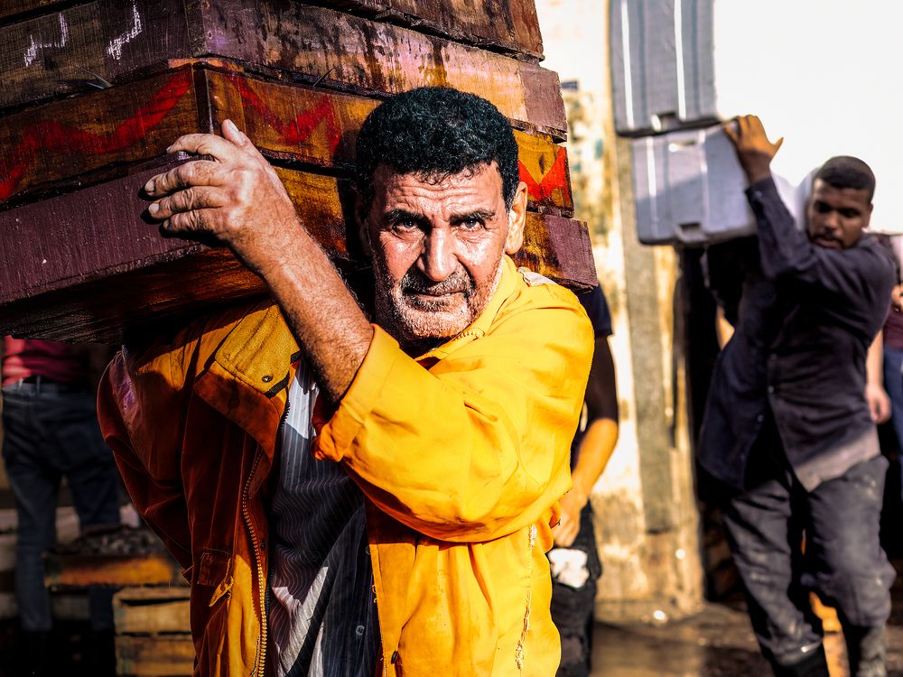 A photograph of a fishmonger at Fish Market