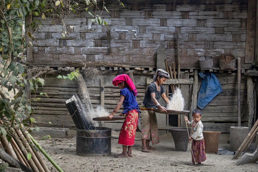 Traditional Process of Husking Rice