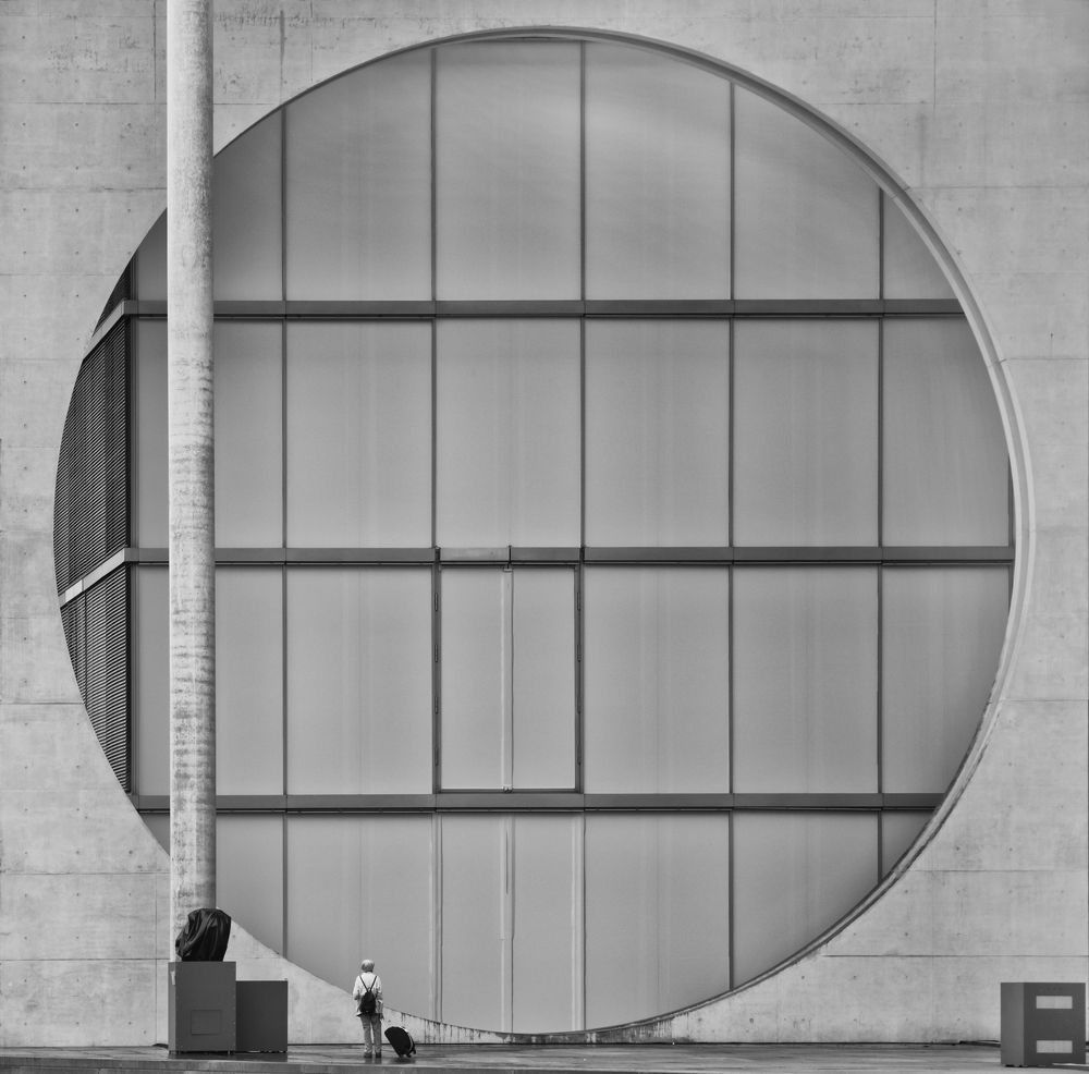 In front of the portal