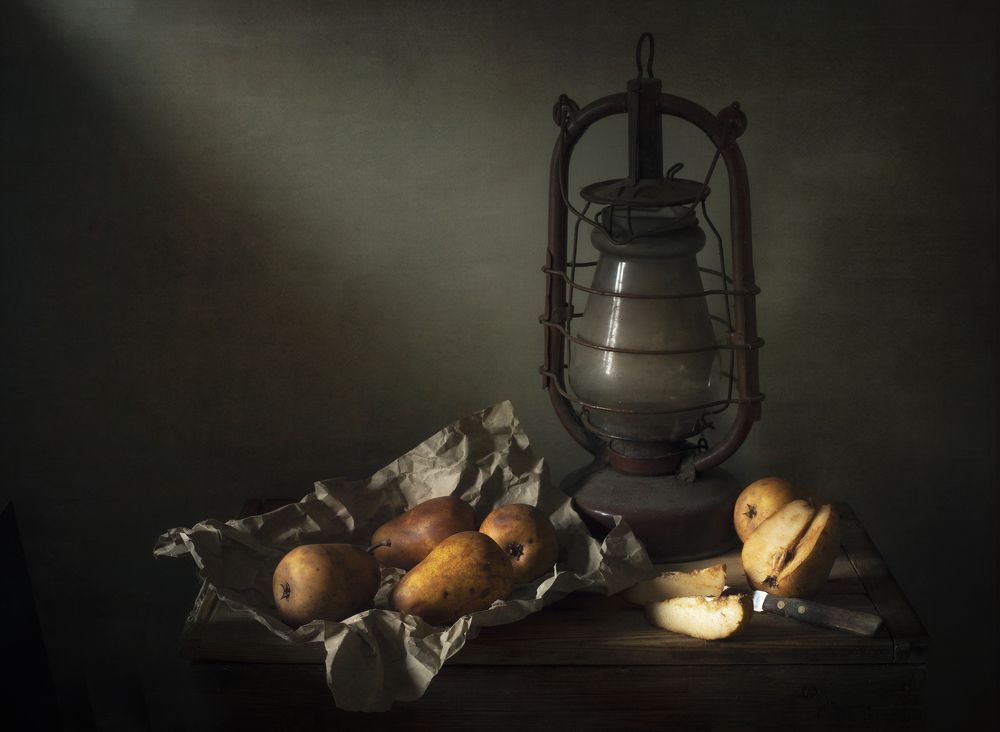 Still life with pears and an extinct lantern