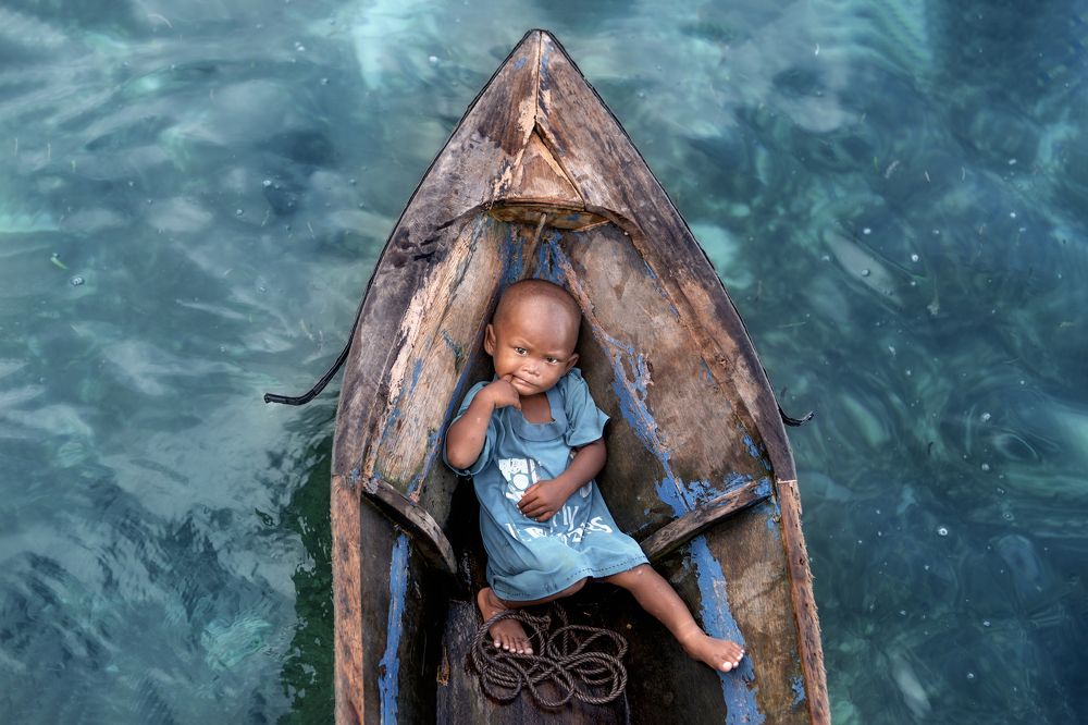 Kid in a boat