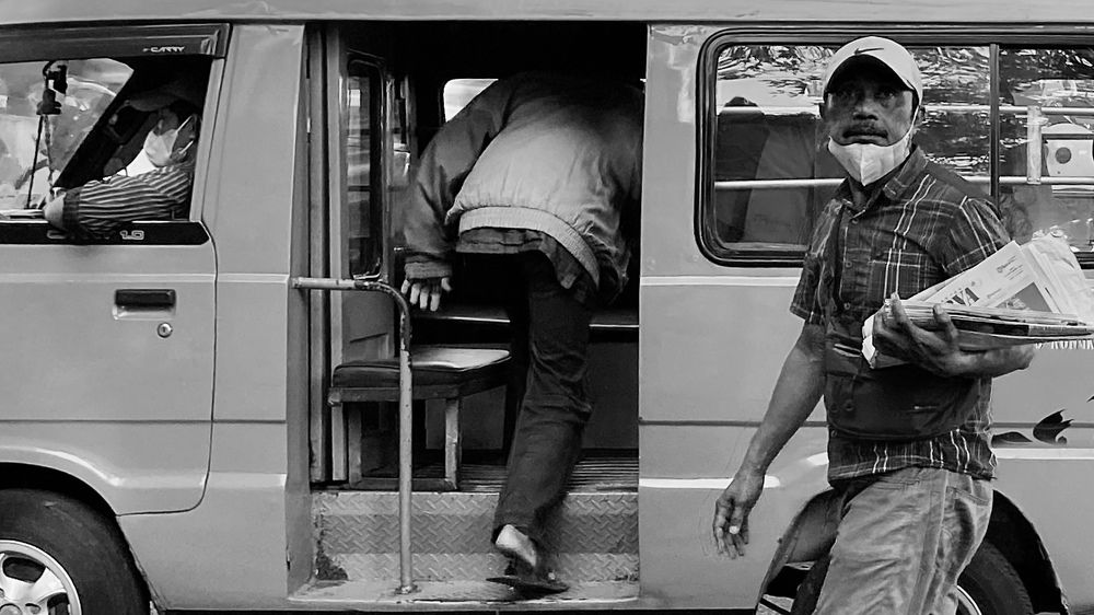 Newspaper seller and the driver