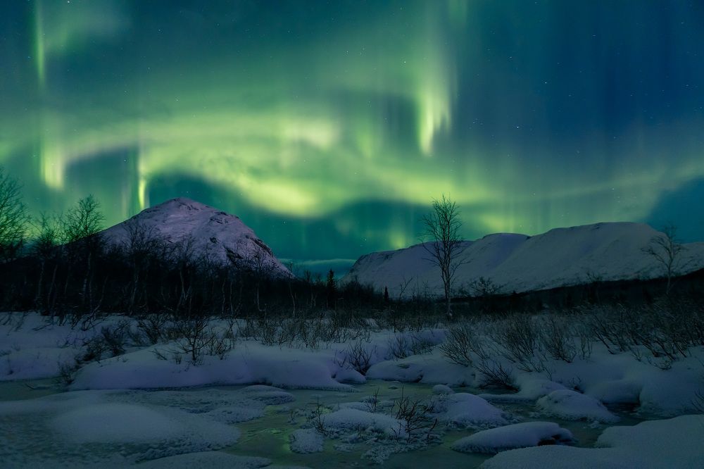 Polar Aurora over the hills