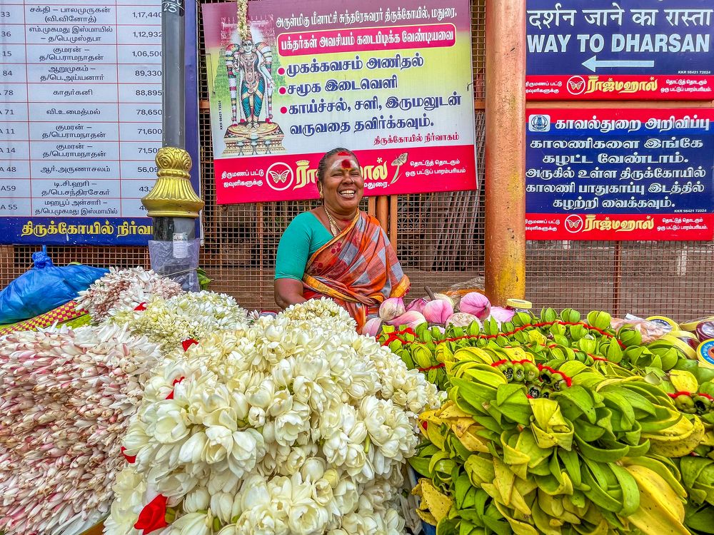 Indian women selling flowers outside the Meenakshi Amman Temple in the city of Madurai, Tamilnadu.