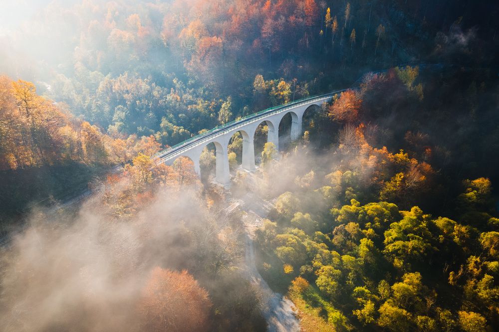 Tranquil autumn morning at the viaduct with the dance of shadow and light
