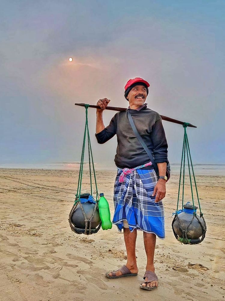 Man selling Date juice in sea beach