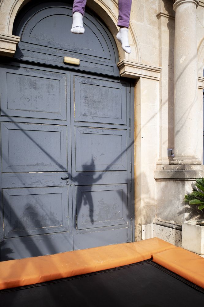 Jumping with her shadow