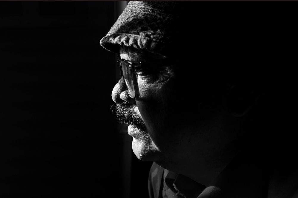 young man in light & shadow