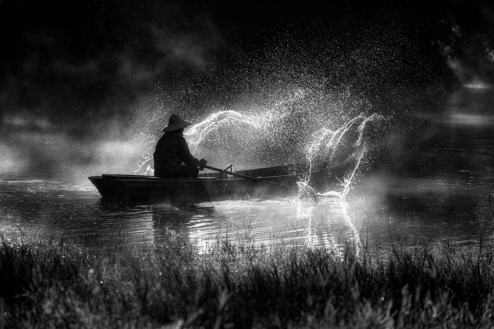 Old man in Tuyen Lam lake