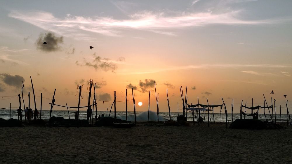 A Sandy Sunset and Silhouettes