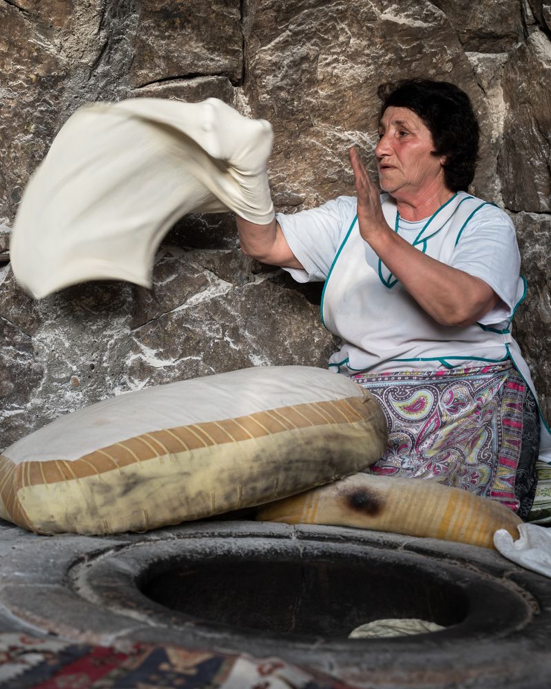 Armenian woman cooks lavash