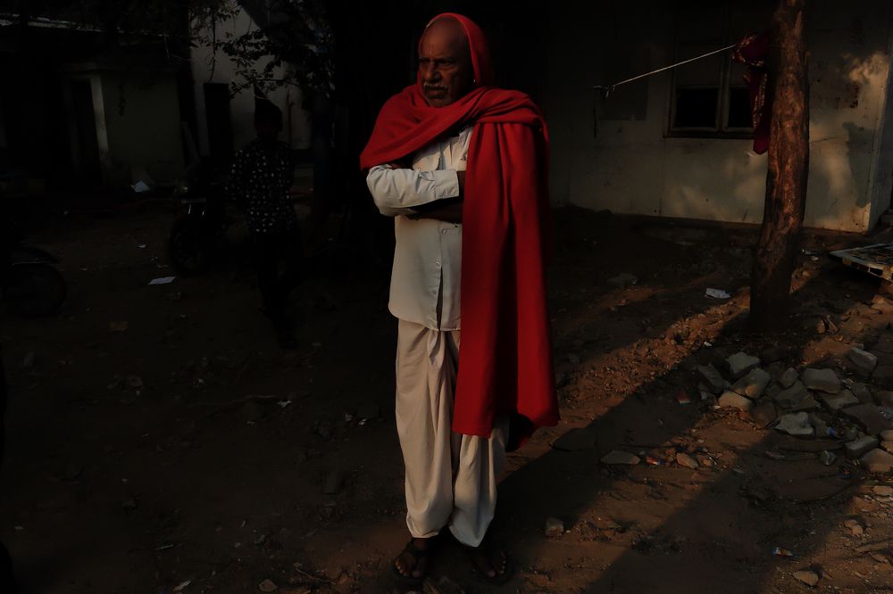 Old man wrapped in Red shawl
