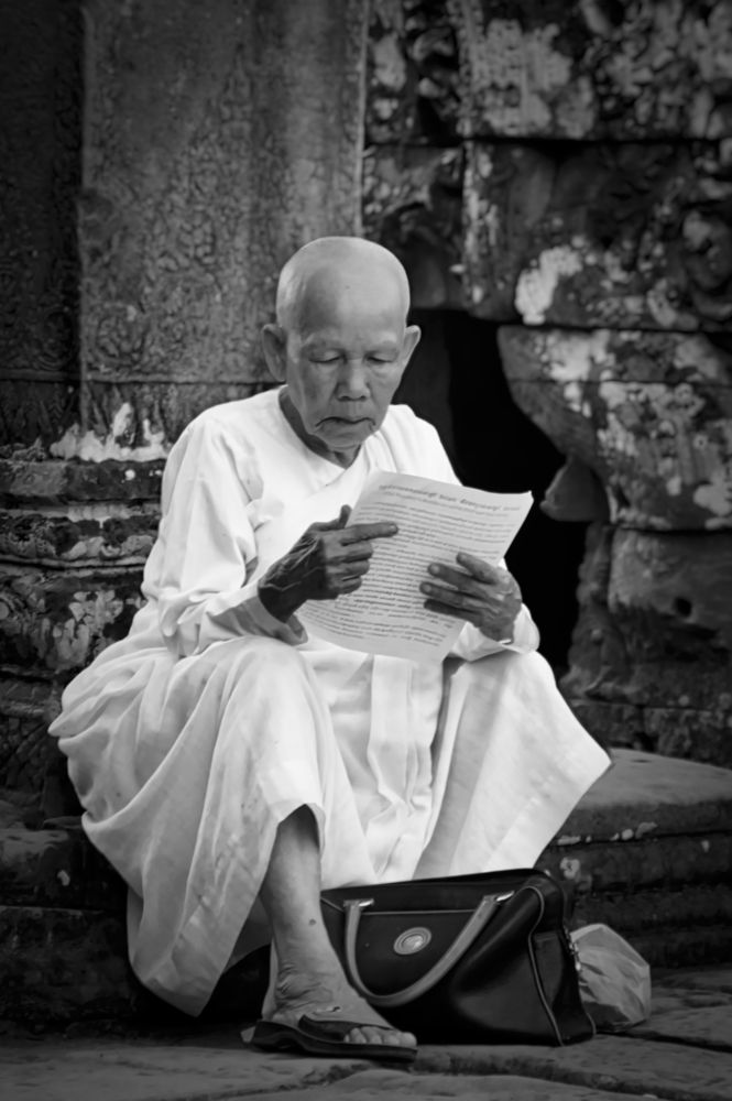 Reading a Decree. Siem Reap, Cambodia.