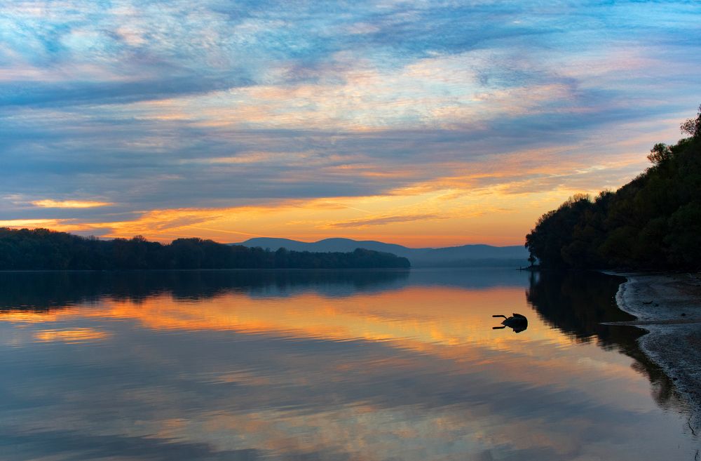 Colorful clouds reflection on water